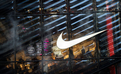 Nike beats estimates boosted by discounts, promotions; shares surge.